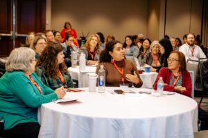 An attendee speaks during a session